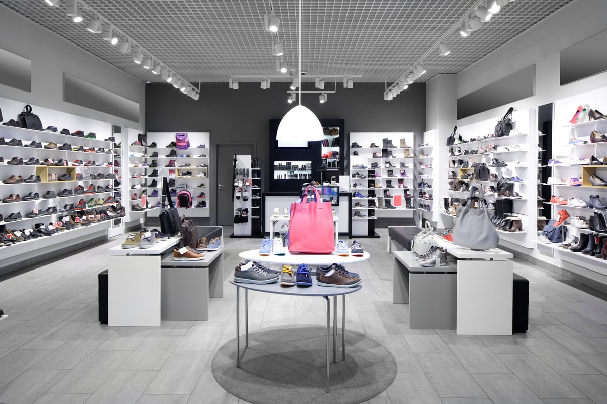 Bright and Fashionable Interior of Shoe Store in Modern Mall