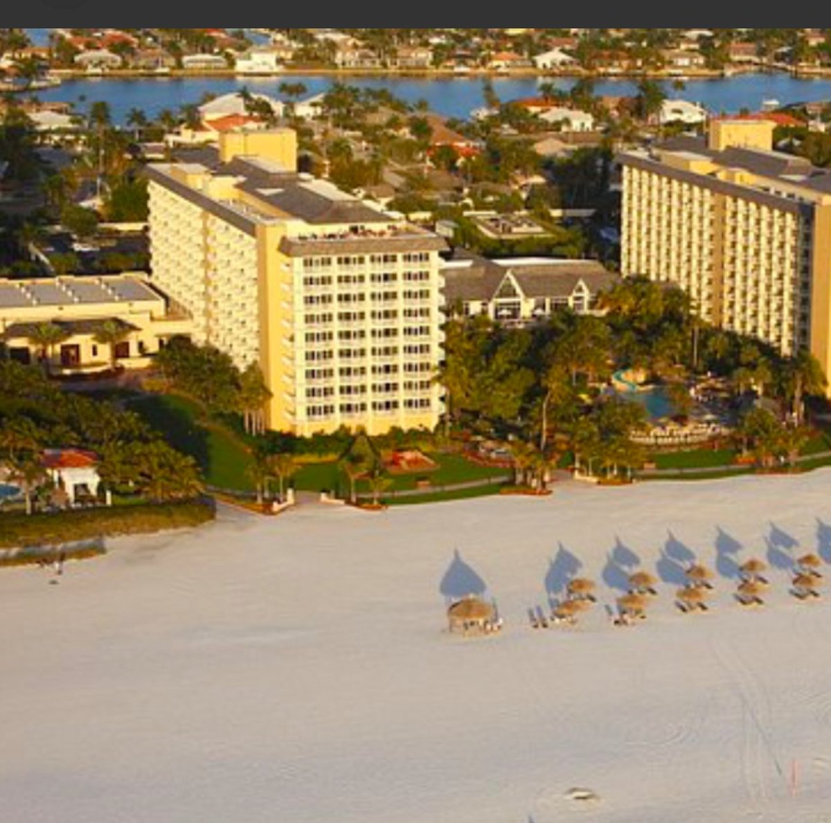 Aerial view of Marriott Marco Beach Hotel resort with high-rise hotels and beachfront amenities