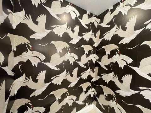 Tessellating pattern of white and black birds in flight with interlocking wings and bodies